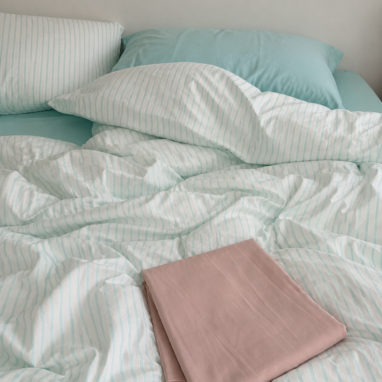 Customer photo with striped cotton bedding